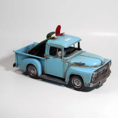 BLUE  TRUCK WITH SURF BOARDS