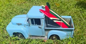 BLUE  TRUCK WITH SURF BOARDS