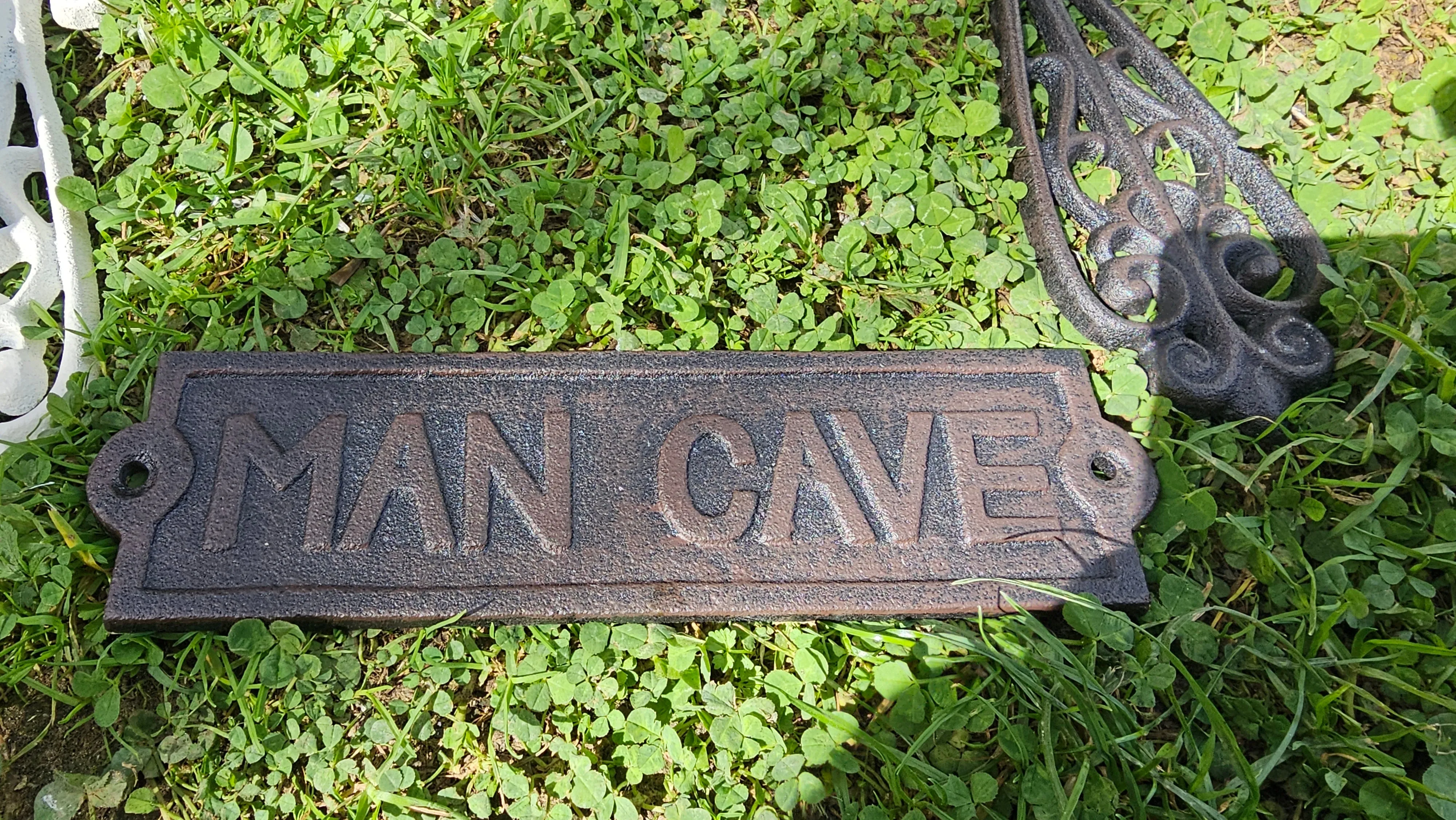 CAST IRON MAN CAVE SIGN